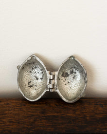 Lemon pewter ice cream mould on wooden surface