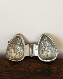 Strawberry pewter ice cream mould on wooden background