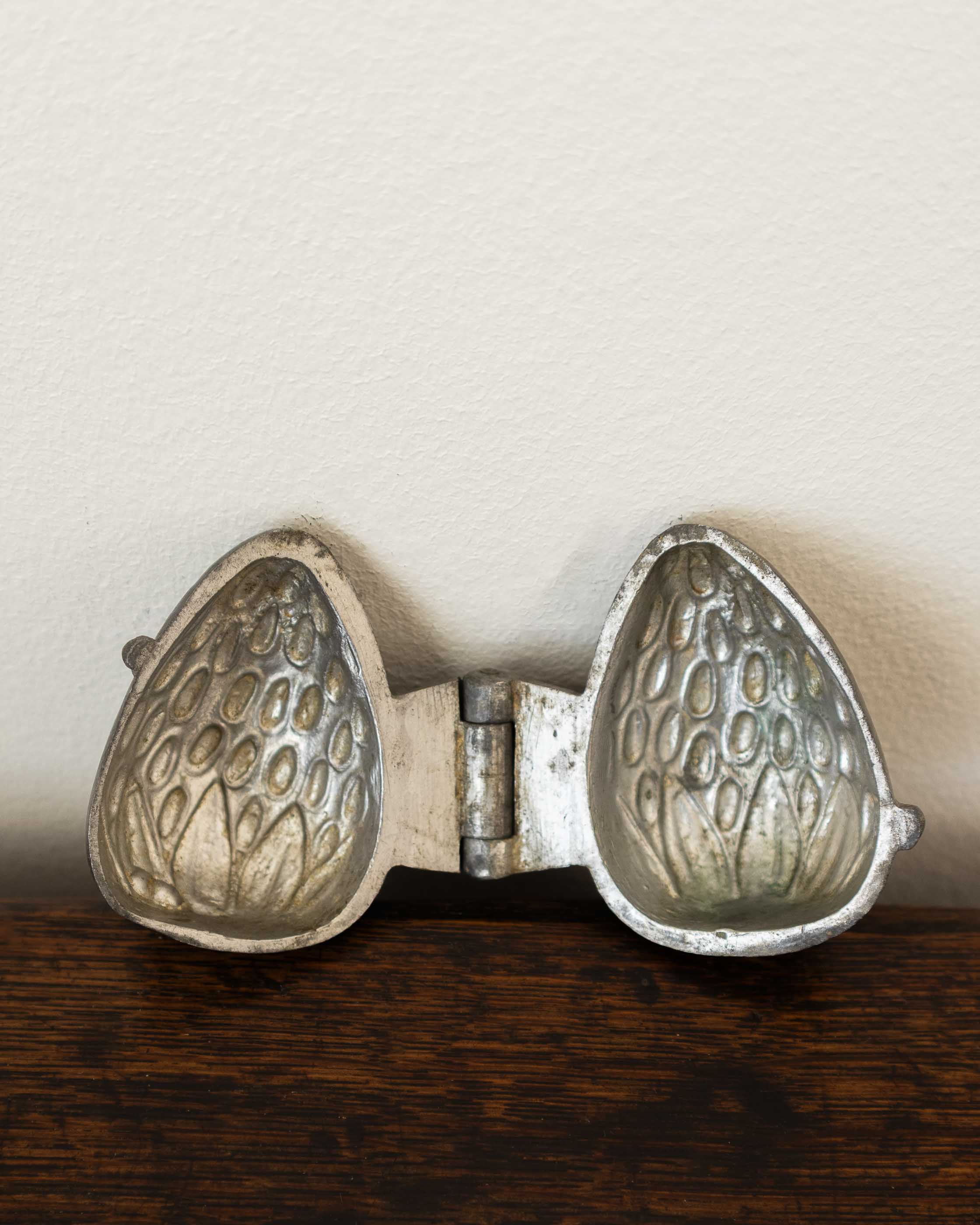 Strawberry pewter ice cream mould on wooden background