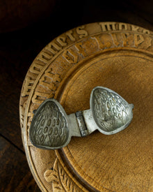 Strawberry pewter ice cream mould on wooden breadboard