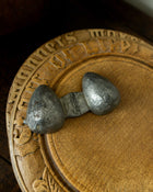 Strawberry pewter ice cream mould on wooden breadboard