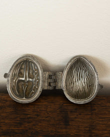 Walnut pewter ice cream mould on wooden surface