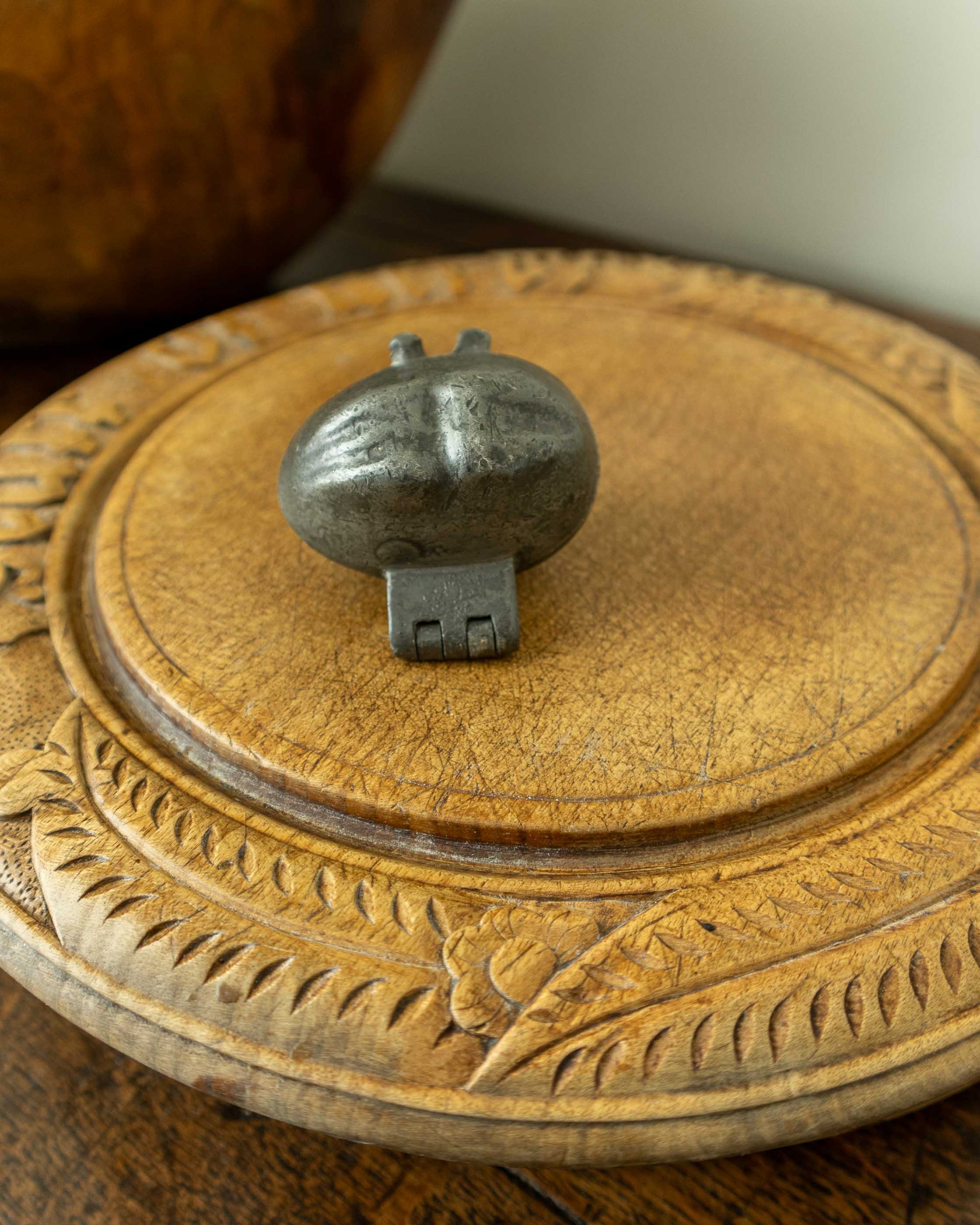 Lemon pewter ice cream mould on wooden breadboard