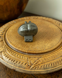 Lemon pewter ice cream mould on wooden breadboard