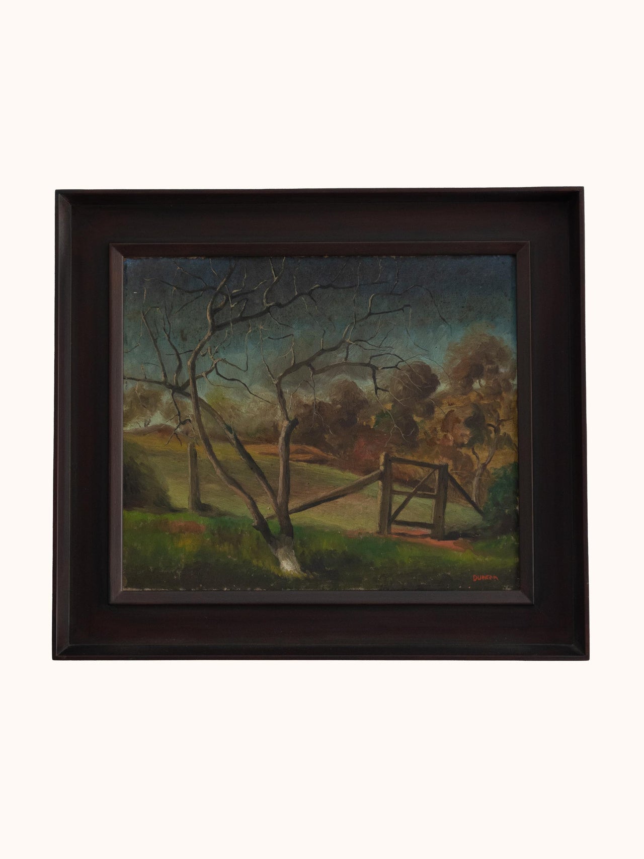 Framed painting of a landscape with a gate and trees on a white background