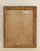 Back of a painting with a wooden frame and visible hardware on a white wall.