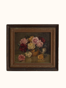 Framed painting of a still life with flowers on a white background