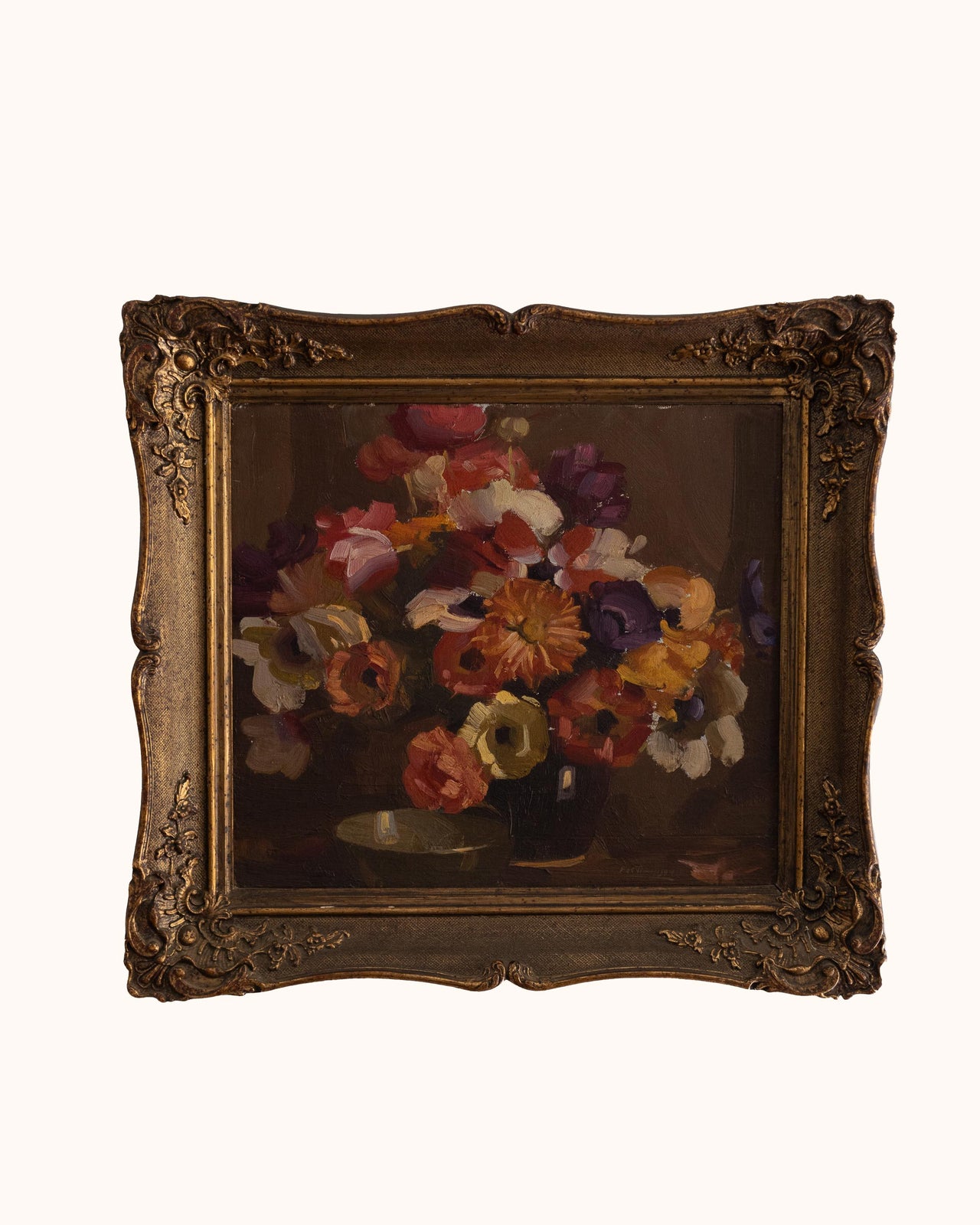 Framed painting of a still life with flowers on a white background