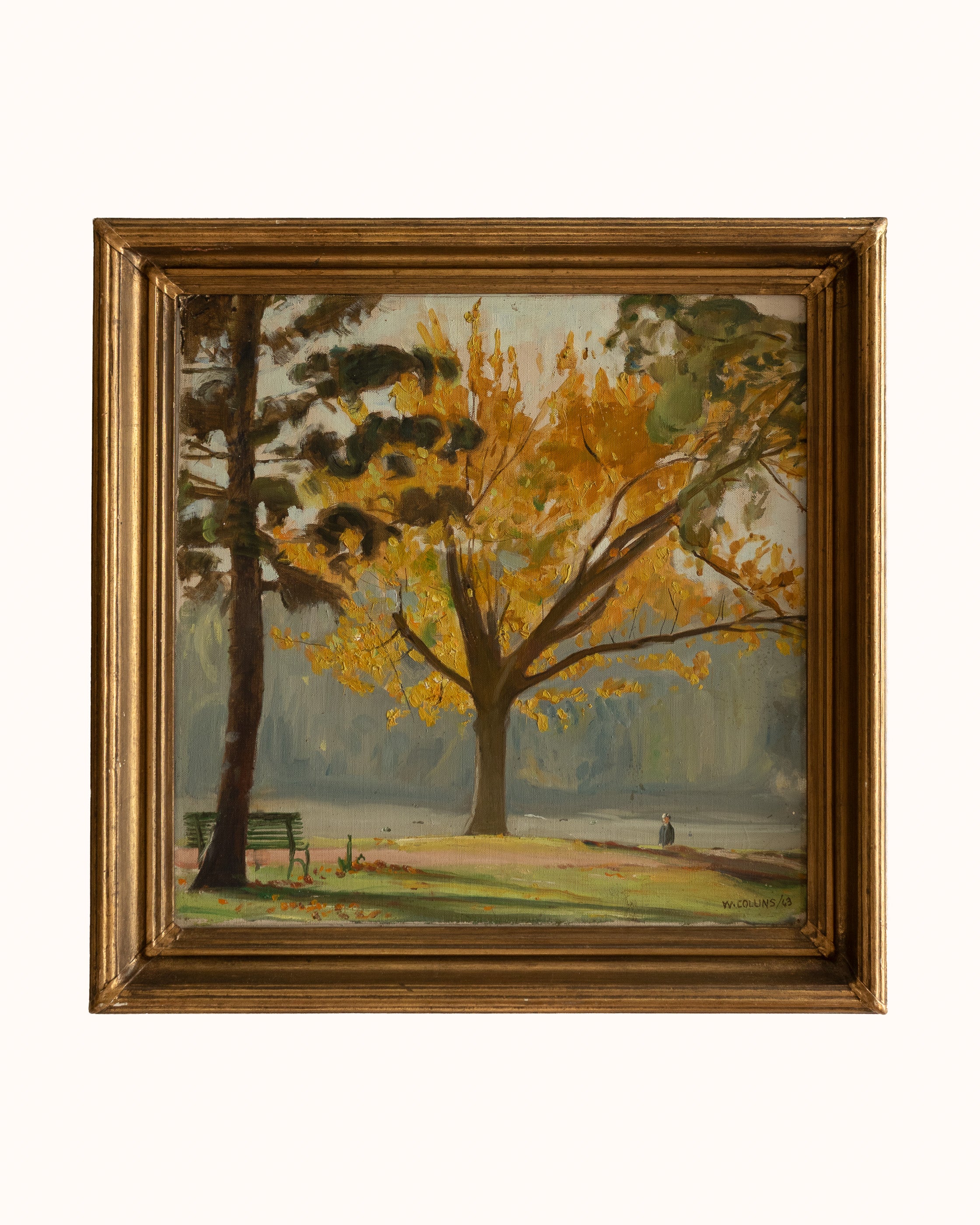 Painting of a tree with yellow leaves in a gold frame on a white background