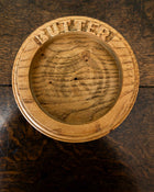 Wooden butter dish a wooden surface