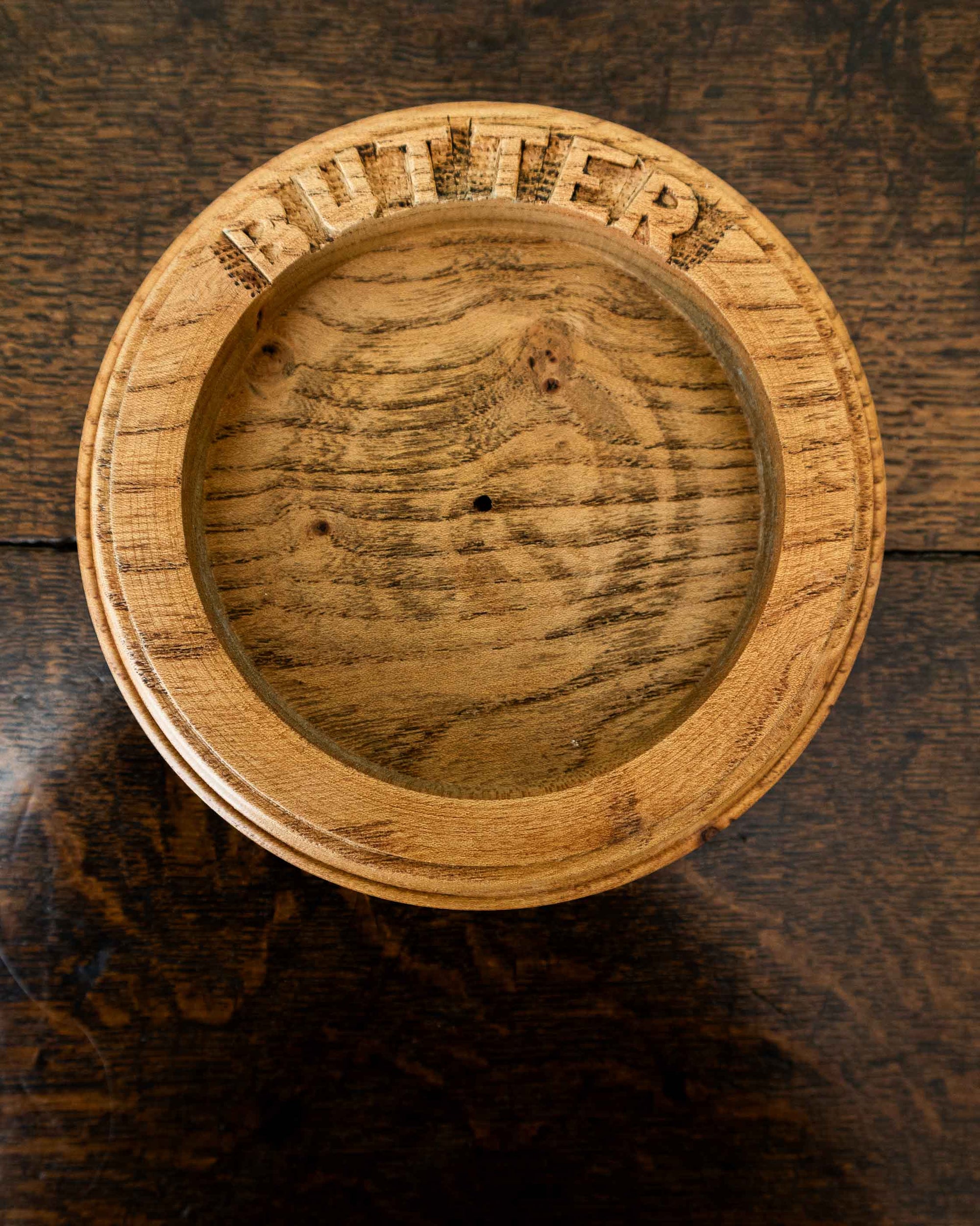 Wooden butter dish a wooden surface