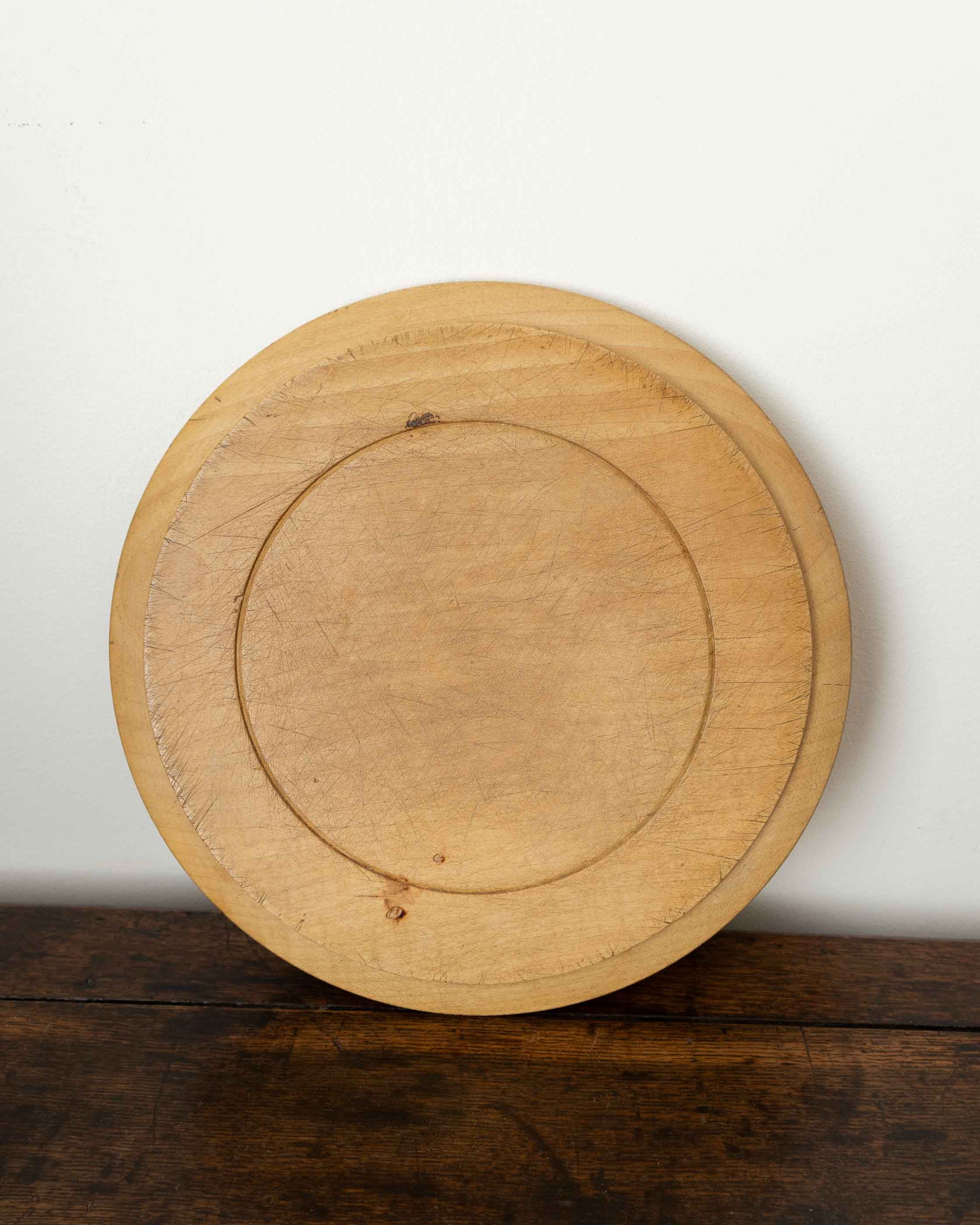 Wooden breadboard on a wooden surface