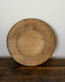 Wooden breadboard on a wooden surface