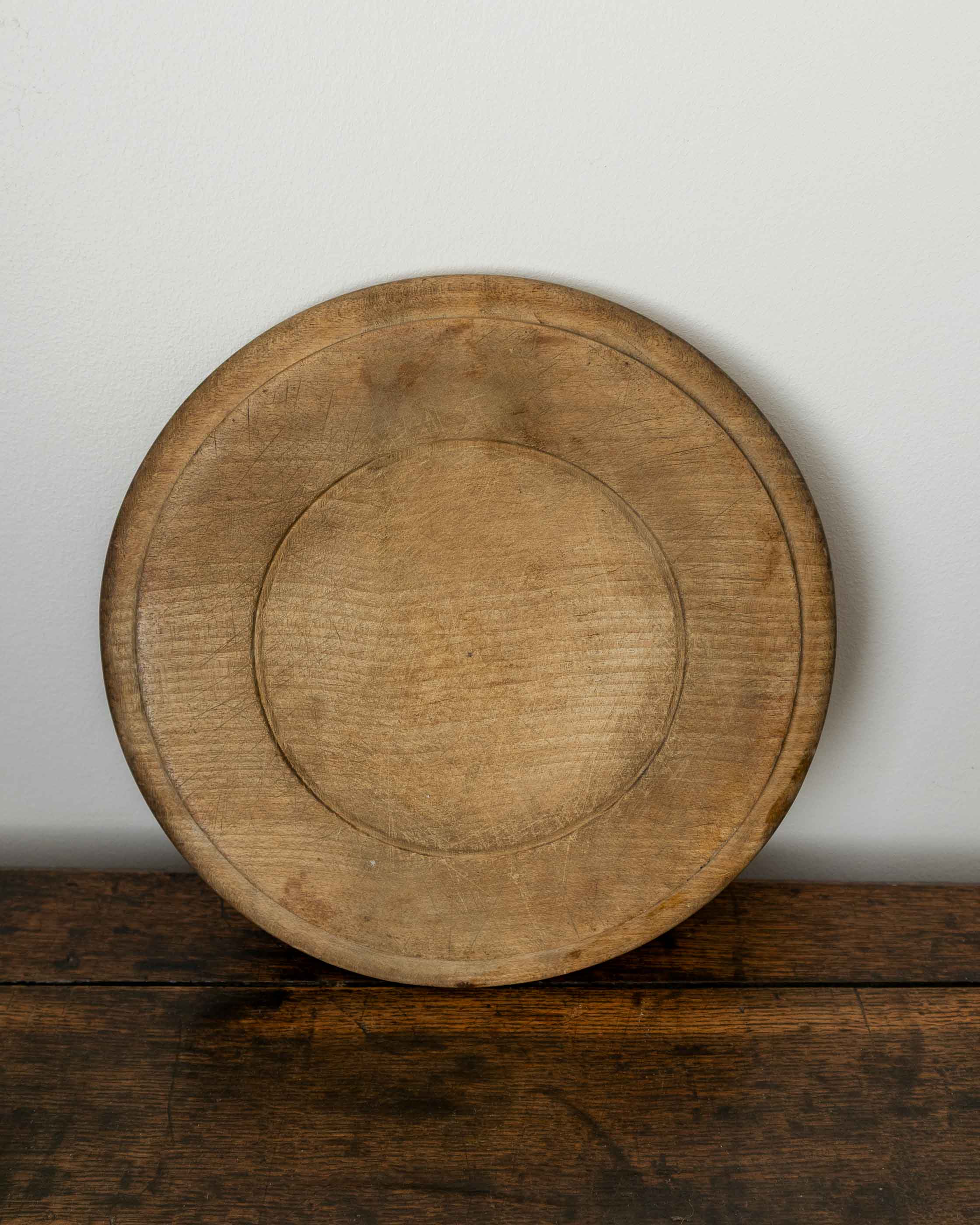 Wooden breadboard on a wooden surface