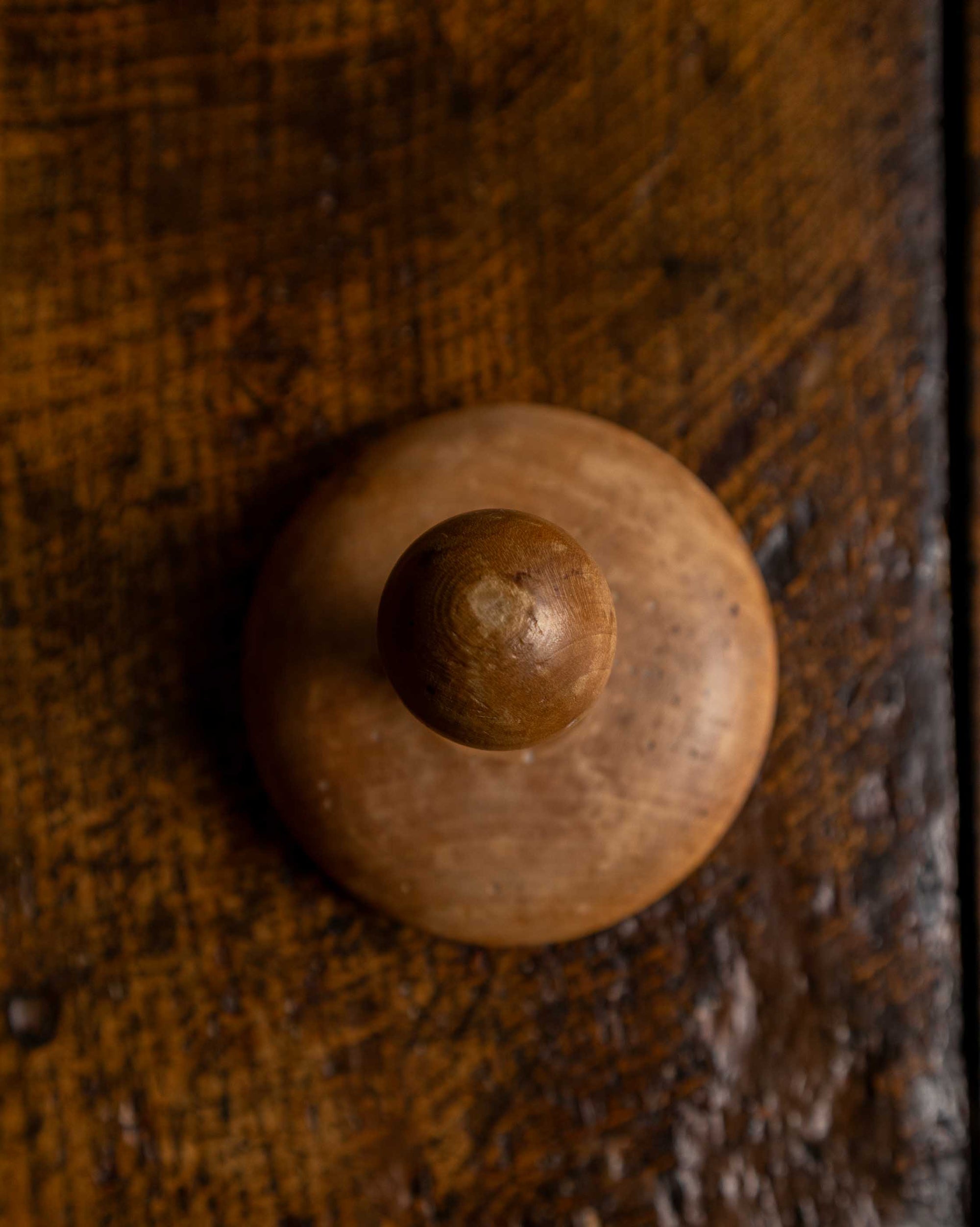 Wooden butter stamp on a wooden surface