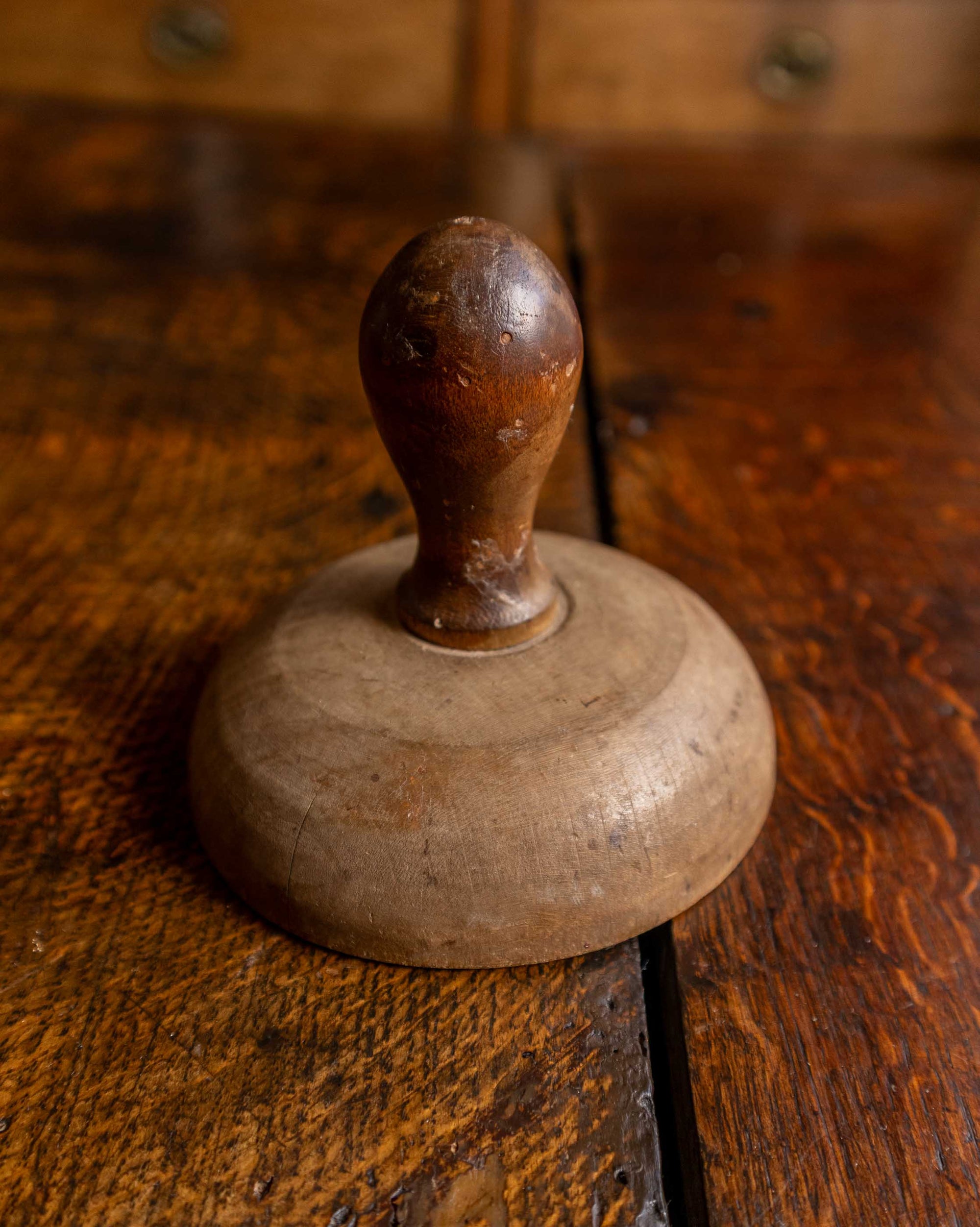 Wooden butter stamp on a wooden surface