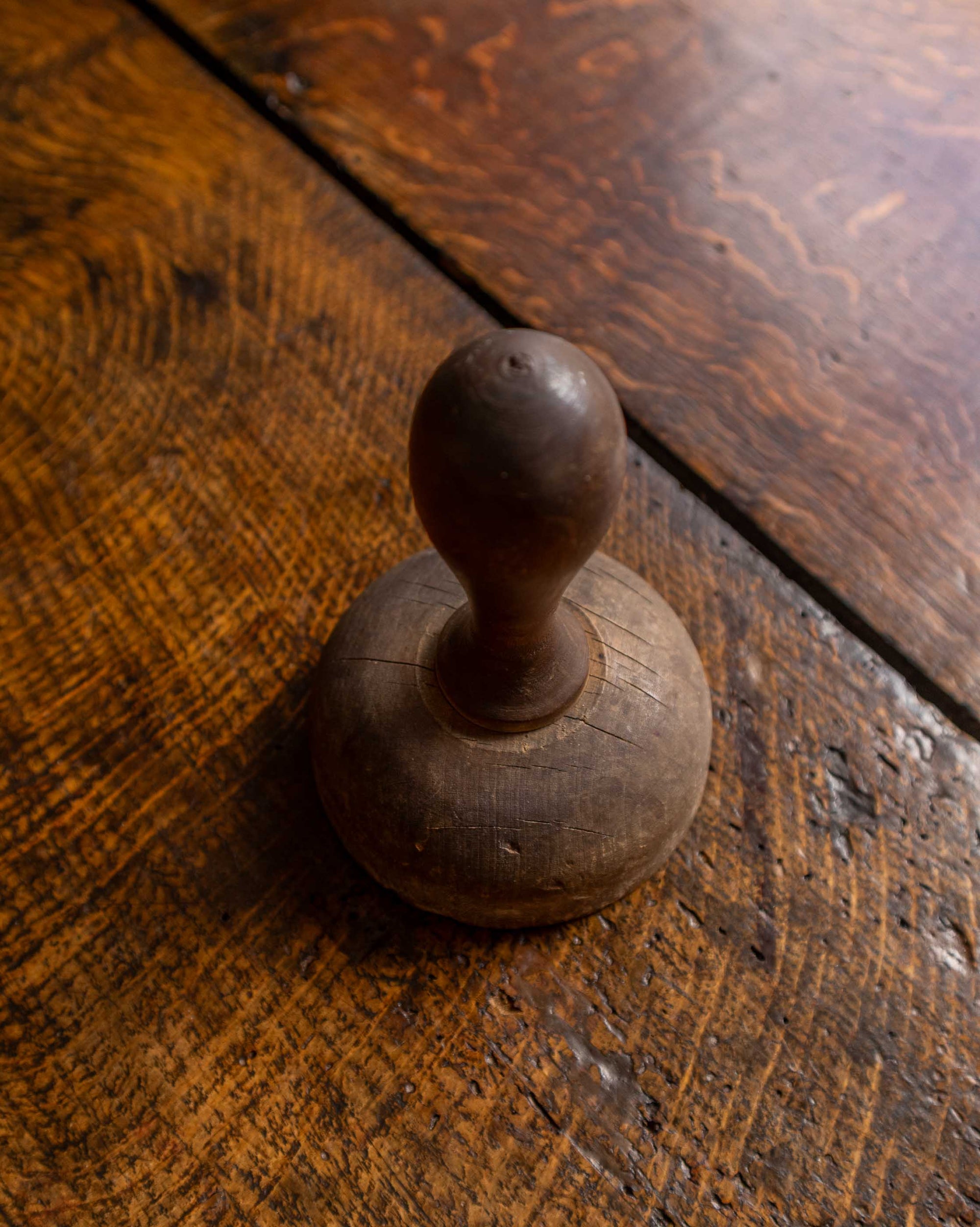 Wooden butter stamp on a wooden surface