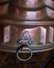 Copper mould on a wooden surface