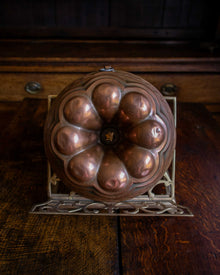 Copper mould on a wooden surface