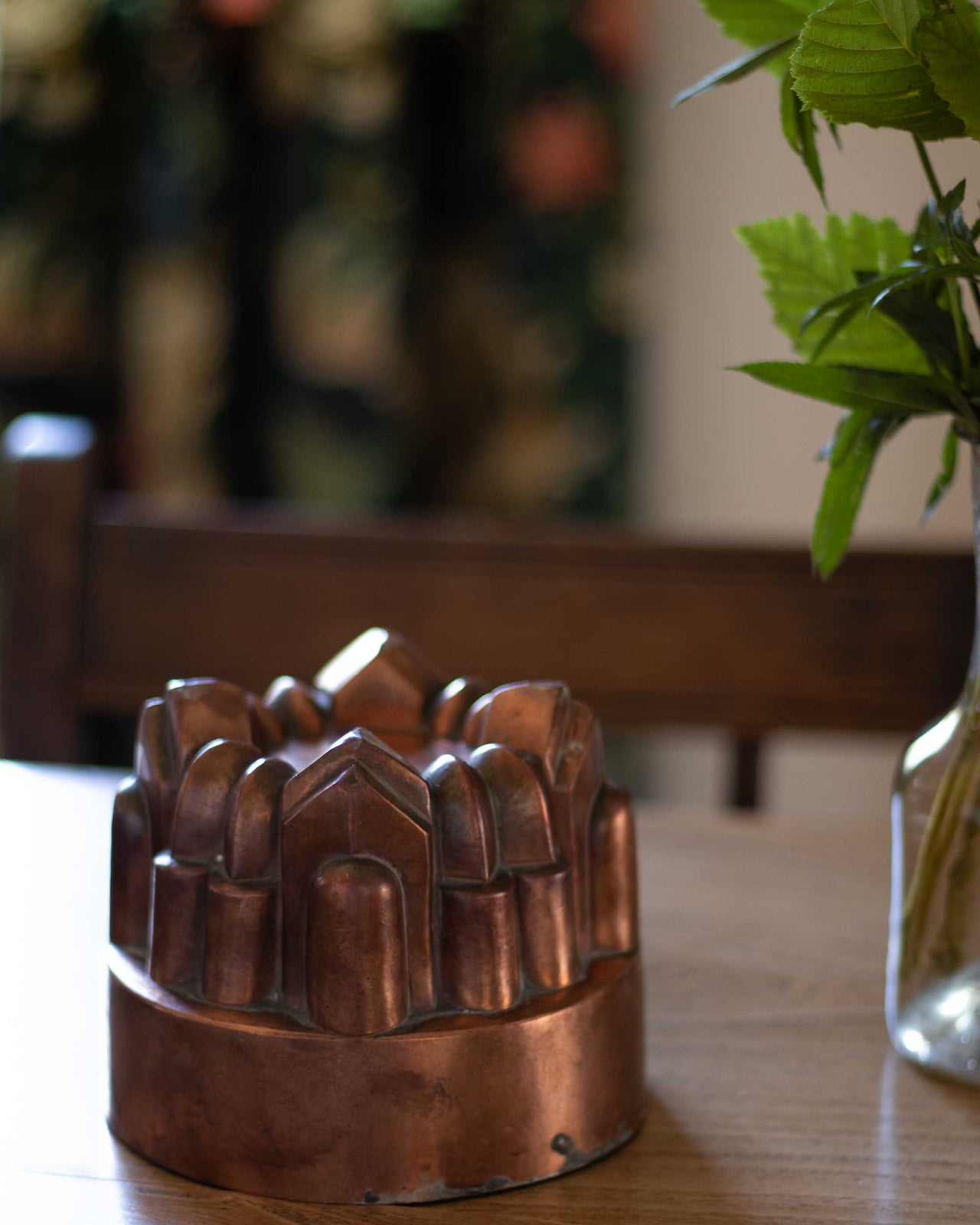 Copper mould on a wooden table with a blurred background