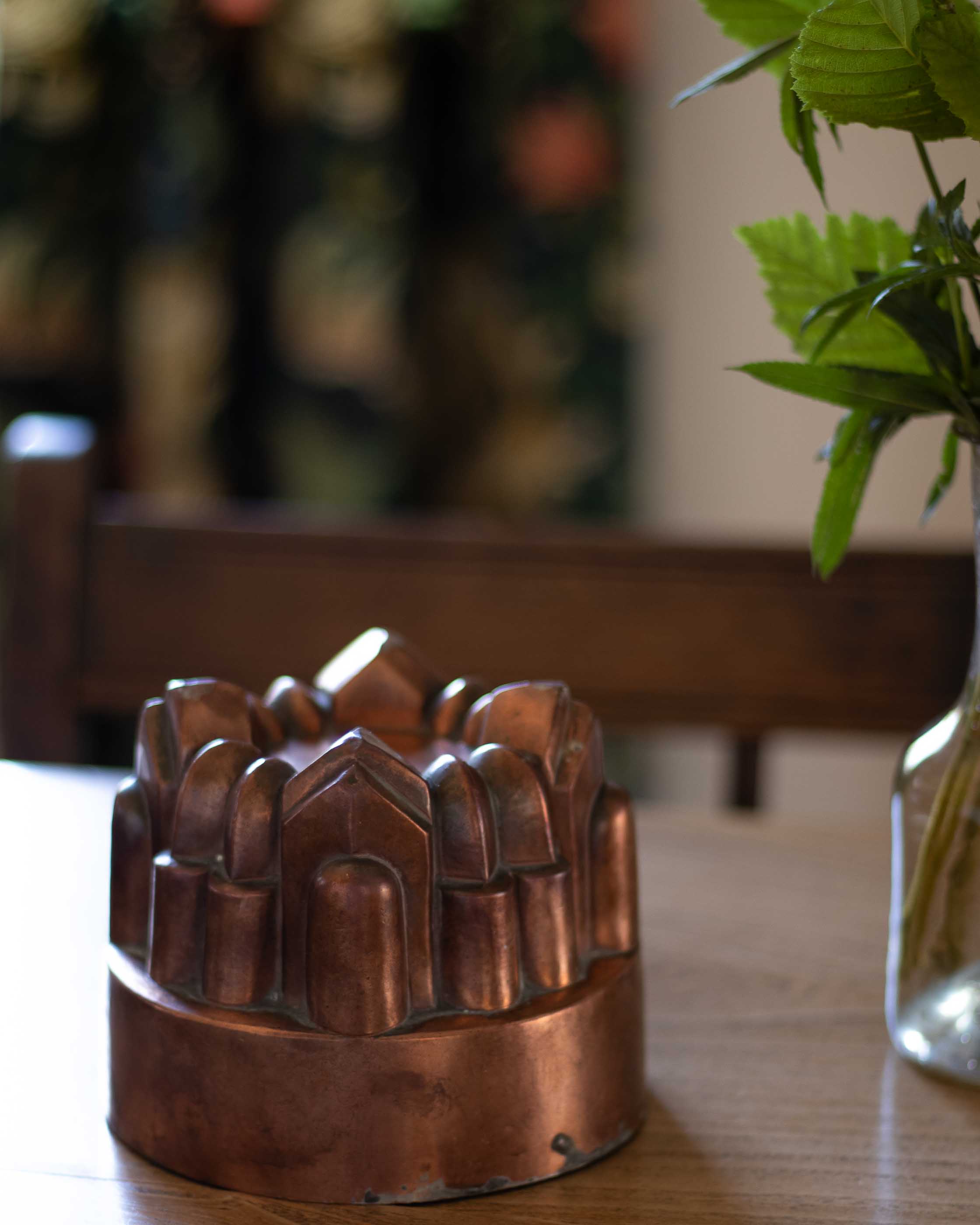 Copper mould on a wooden table with a blurred background