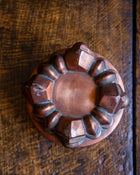 Copper mould on a wooden surface