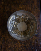 Copper jelly mould on a wooden surface