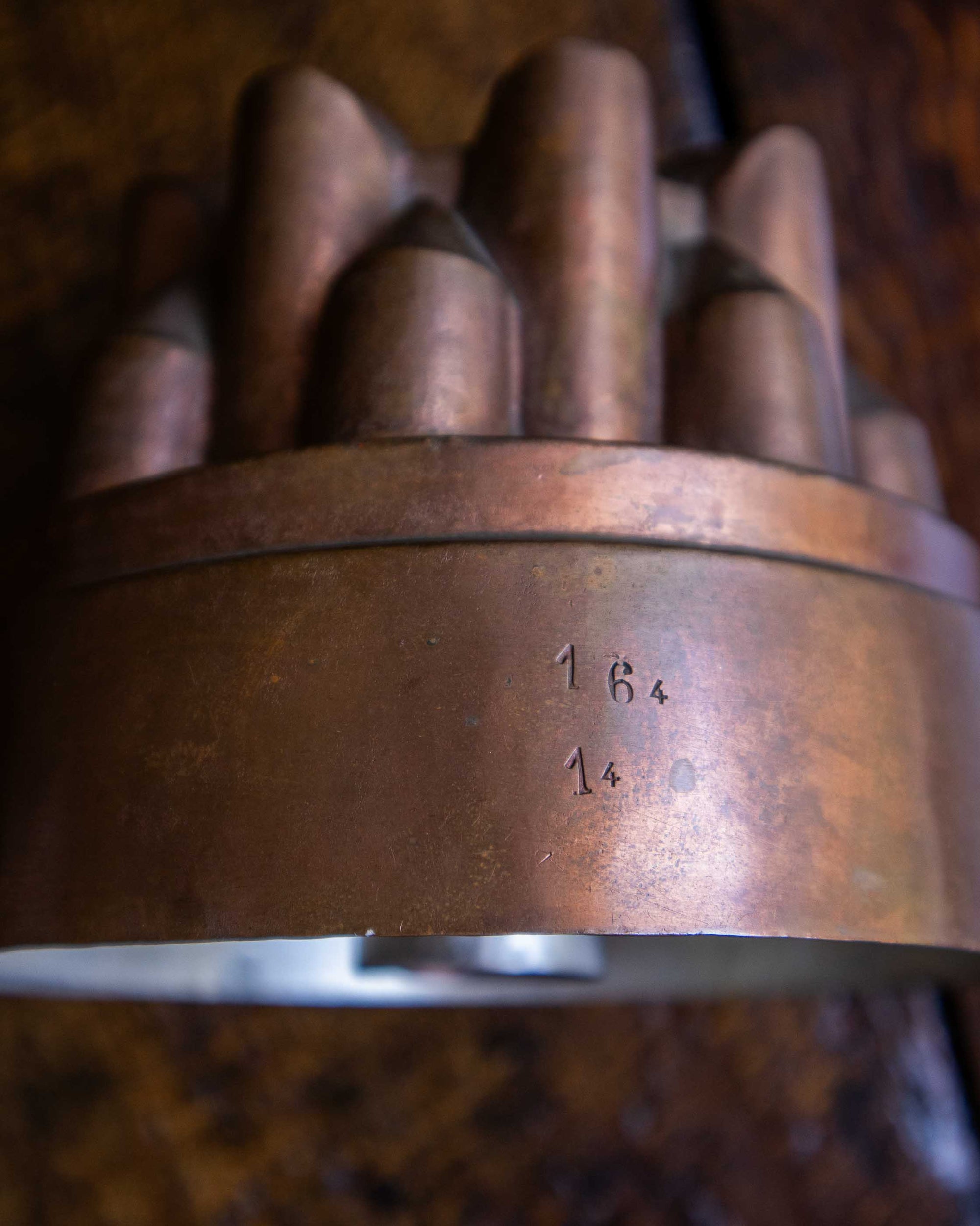 Decorative copper jelly mould on a wooden surface