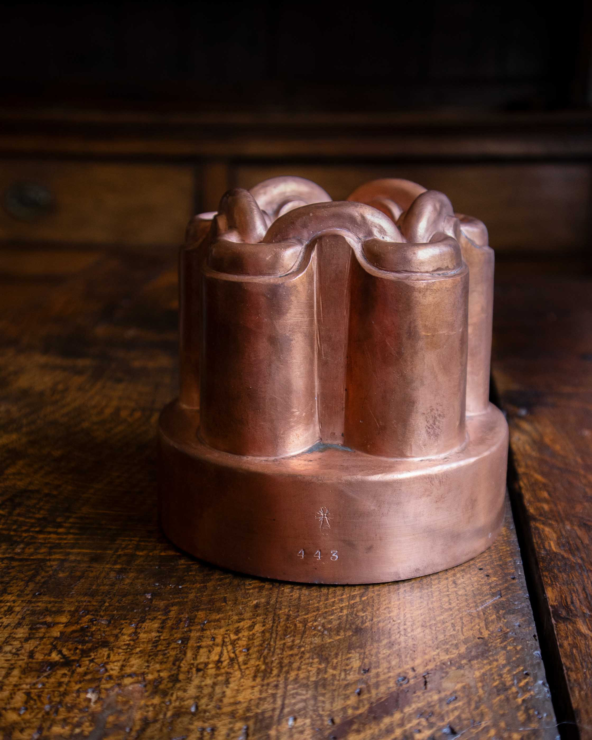 Copper mould on a wooden surface.