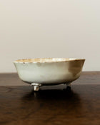 Ceramic mould on a wooden surface with a plain background