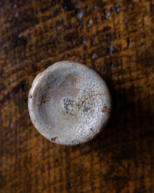 Ceramic pot on a wooden surface