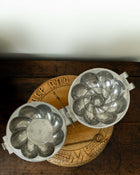 Pewter mould on a wooden breadboard 