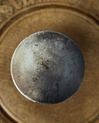 Close-up of a ceramic jar on a wooden surface