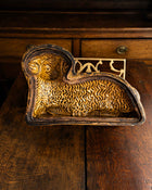 Decorative ceramic lamb mould on a wooden surface