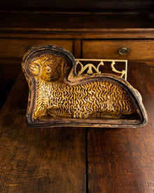 Decorative ceramic lamb mould on a wooden surface