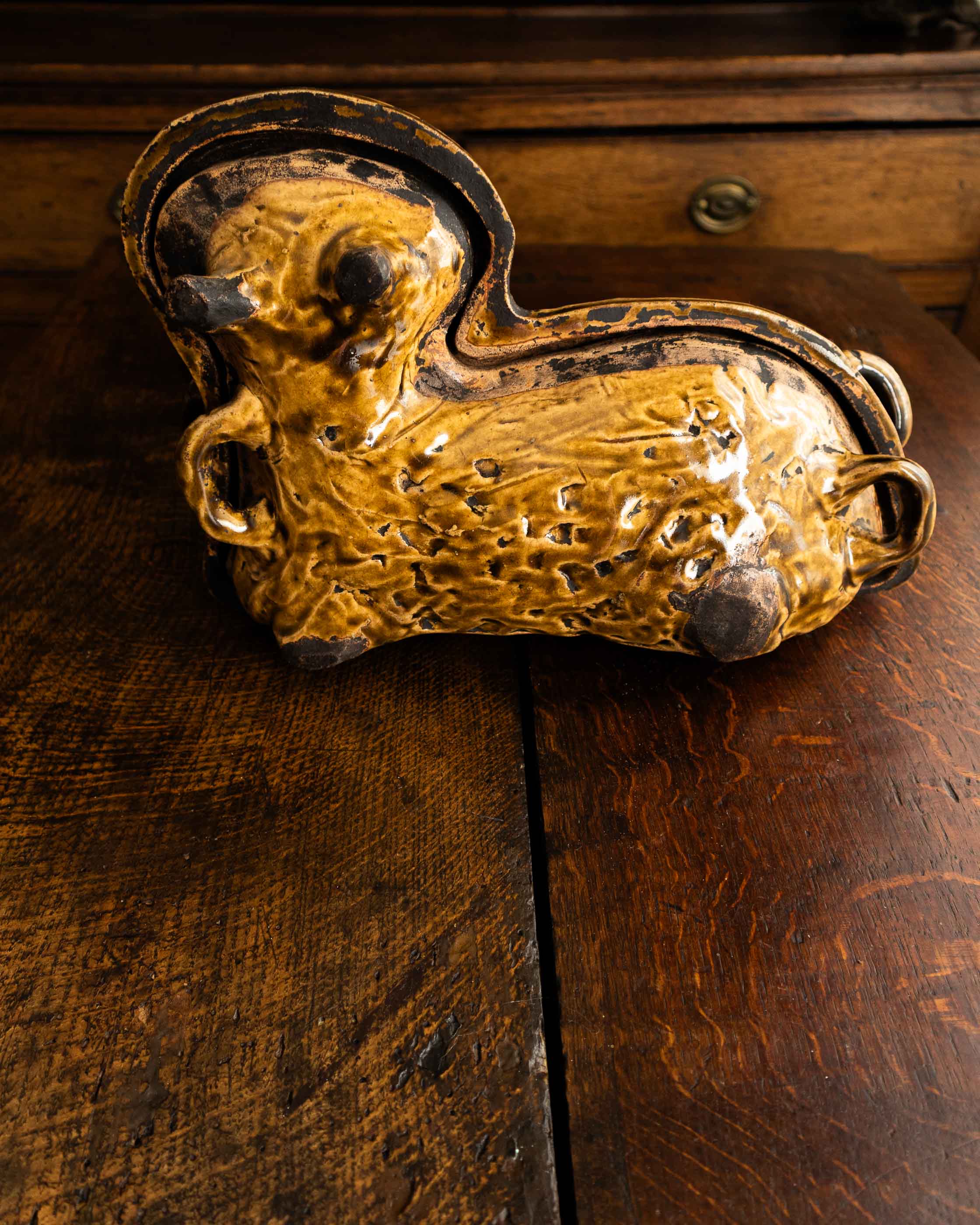 Decorative ceramic lamb mould on a wooden surface
