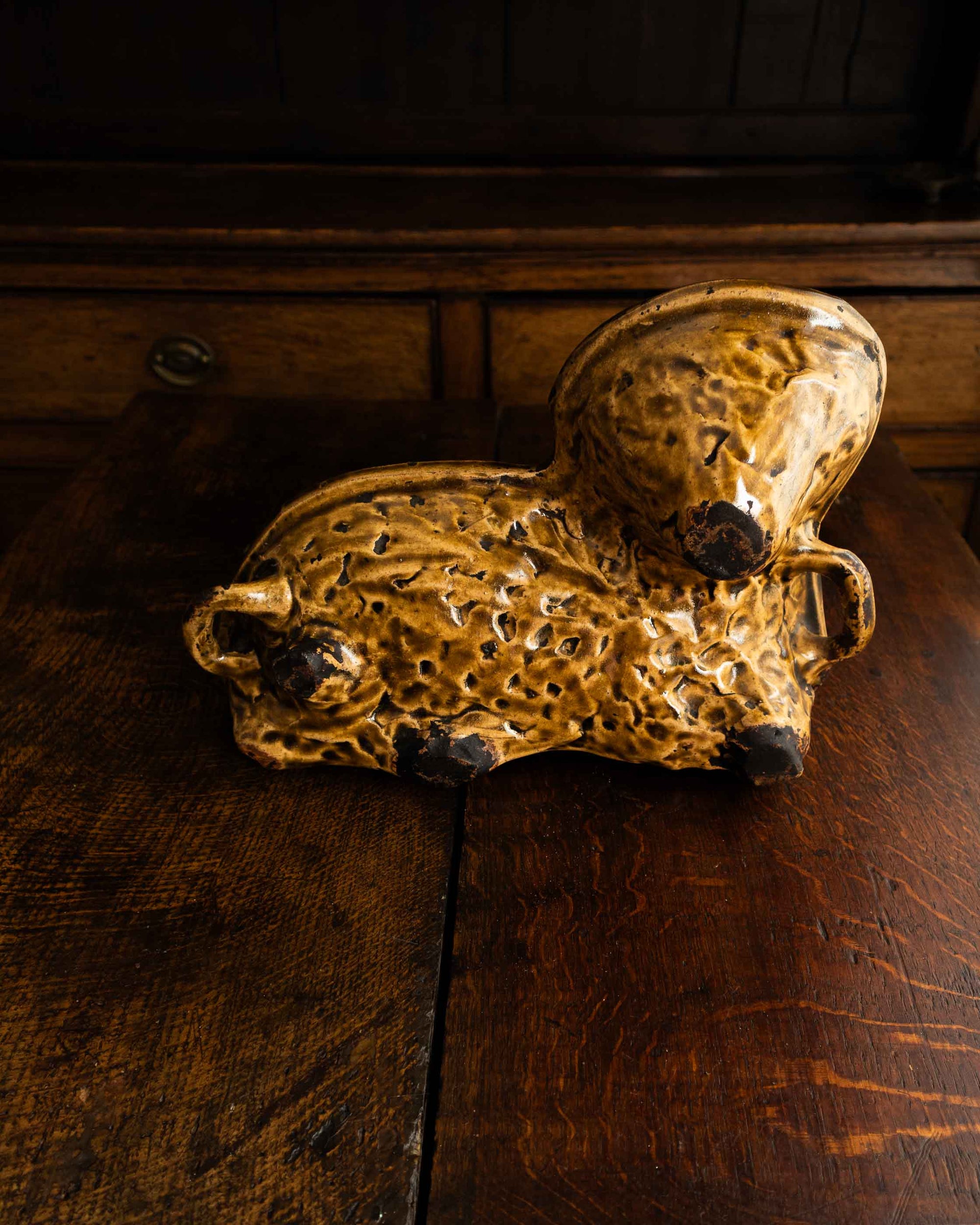 Decorative ceramic lamb mould on a wooden surface