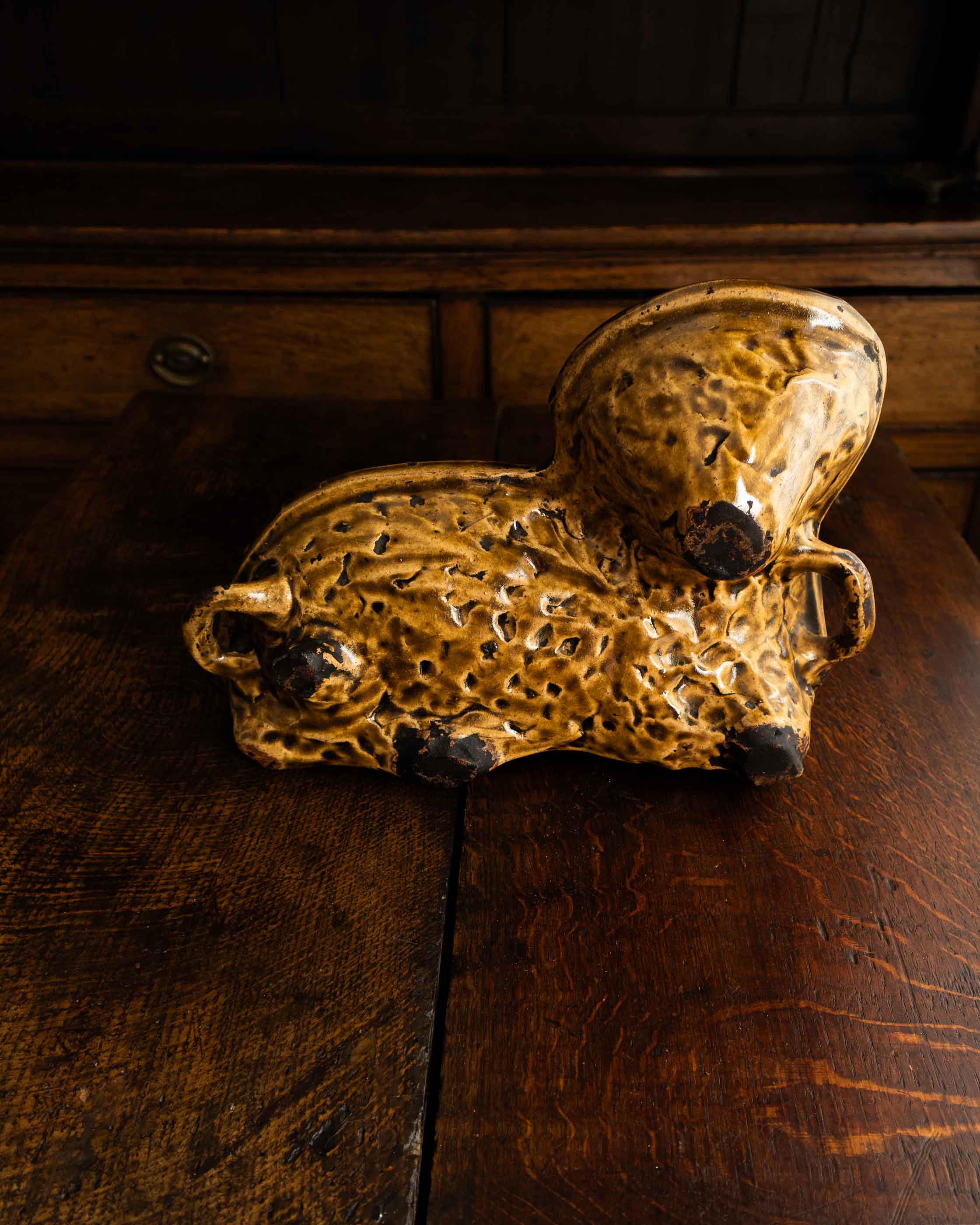 Decorative ceramic lamb mould on a wooden surface