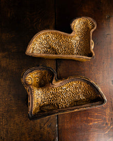 Decorative ceramic lamb mould on a wooden surface