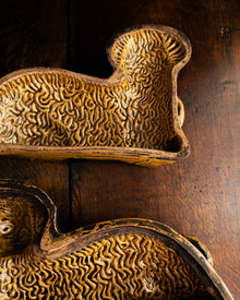 Decorative ceramic lamb mould on a wooden surface