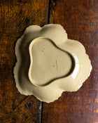 Ceramic Wedgwood dish on a wooden surface