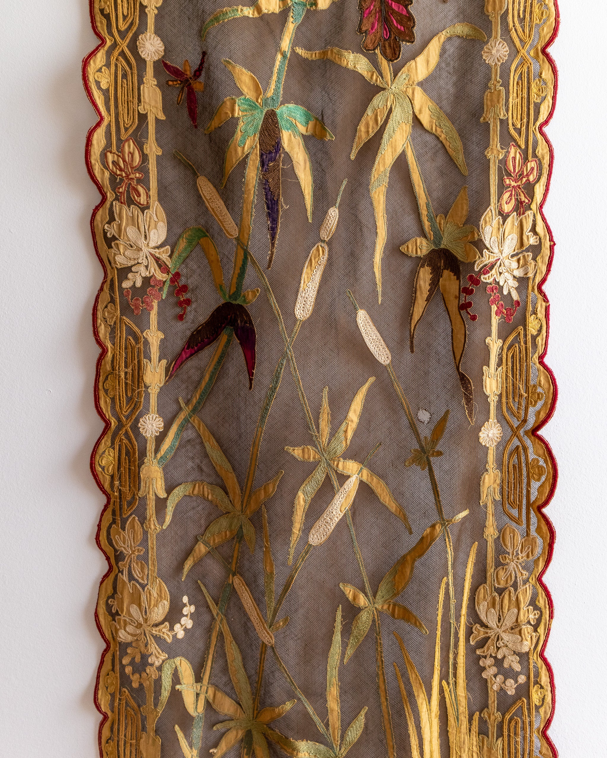 Decorative panel with floral and botanical patterns on a textured background