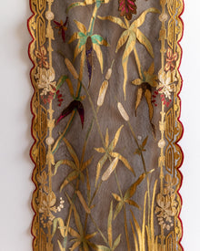 Decorative panel with floral and botanical patterns on a textured background