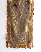 Decorative panel with embroidered floral and botanical patterns on a white background