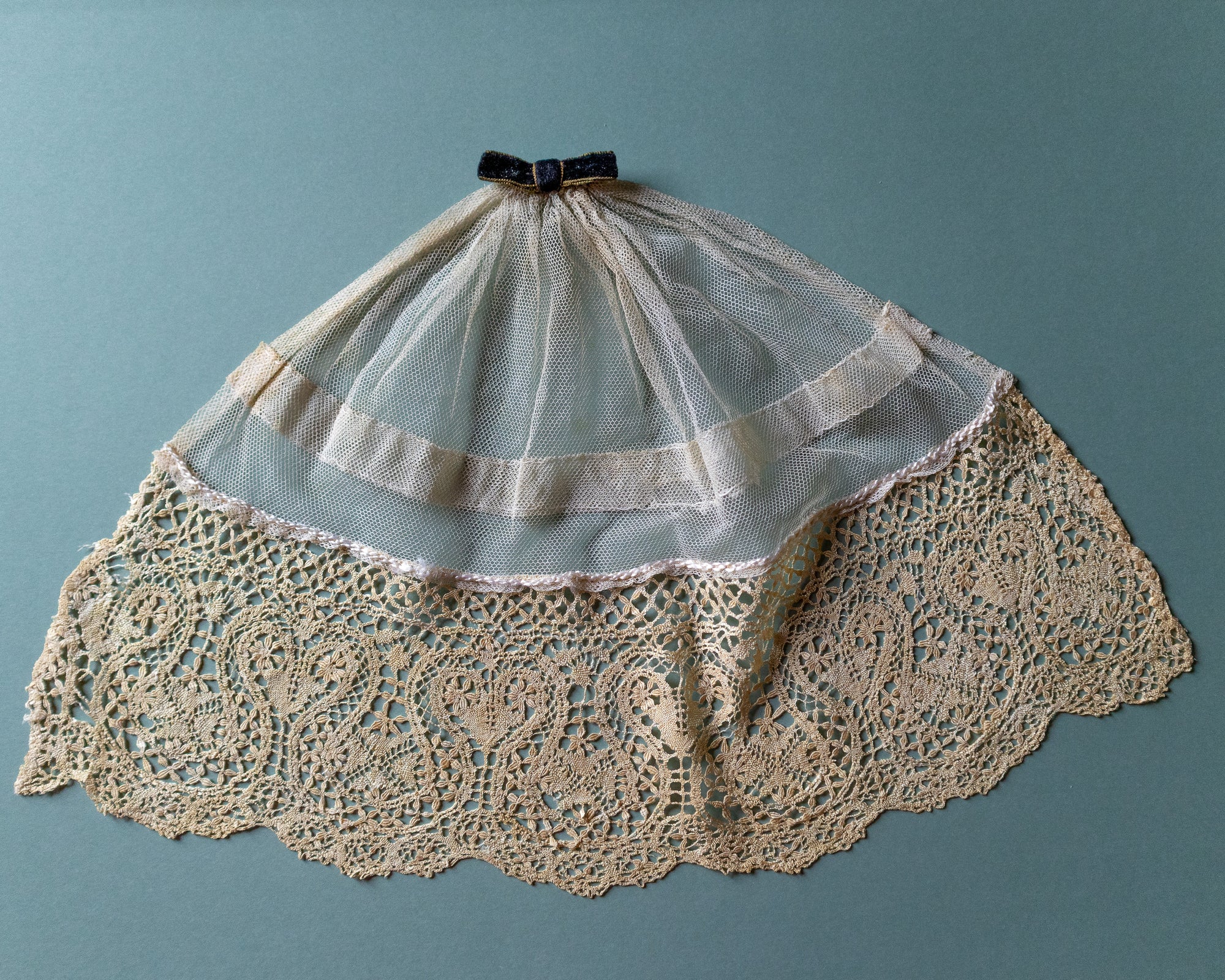 Lace jabot with a blue background