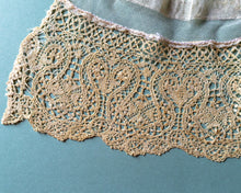 Close-up of lace on a teal background