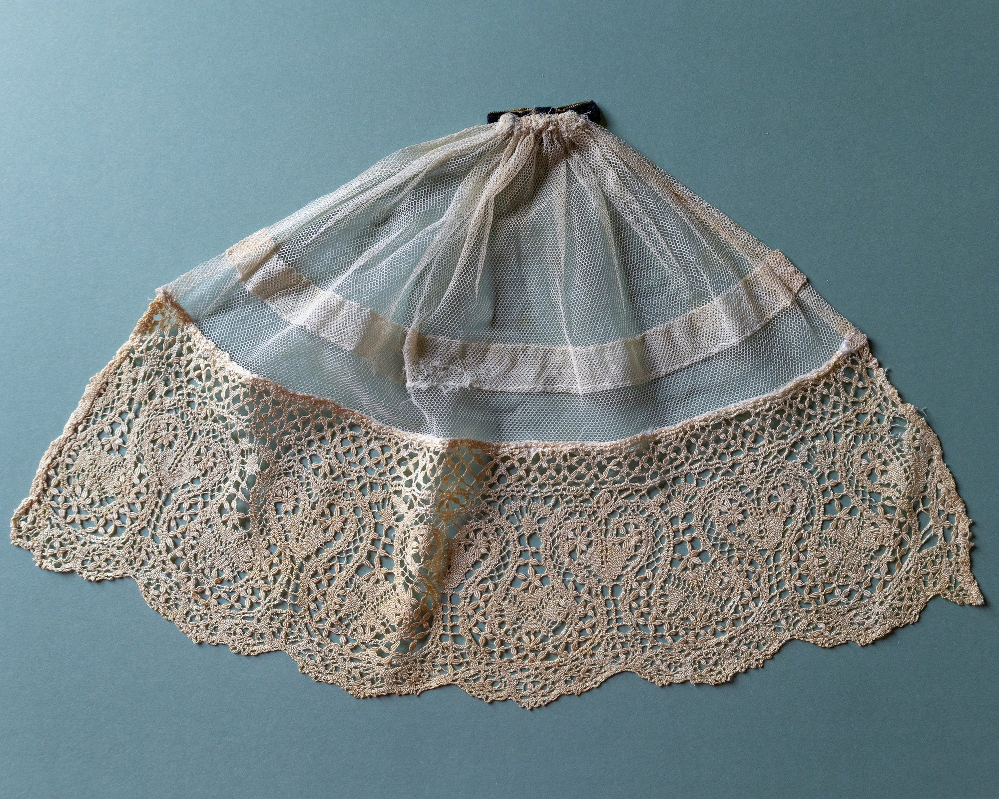 Lace jabot on a blue background