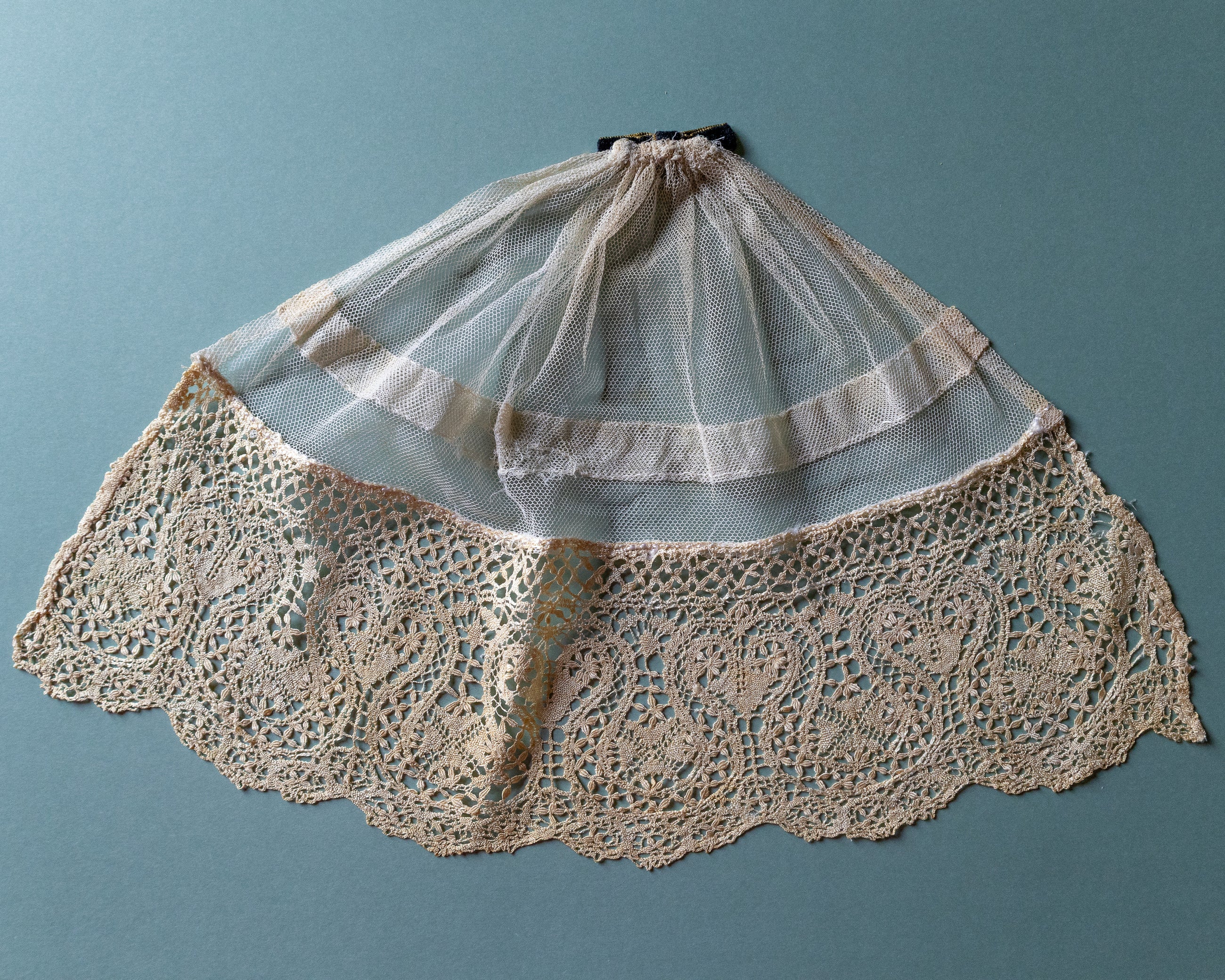 Lace jabot on a blue background