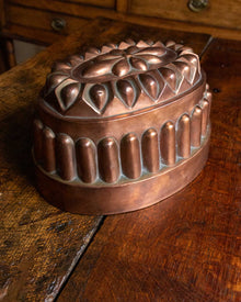 Copper mold on a wooden surface