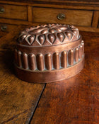 Copper mold on a wooden surface